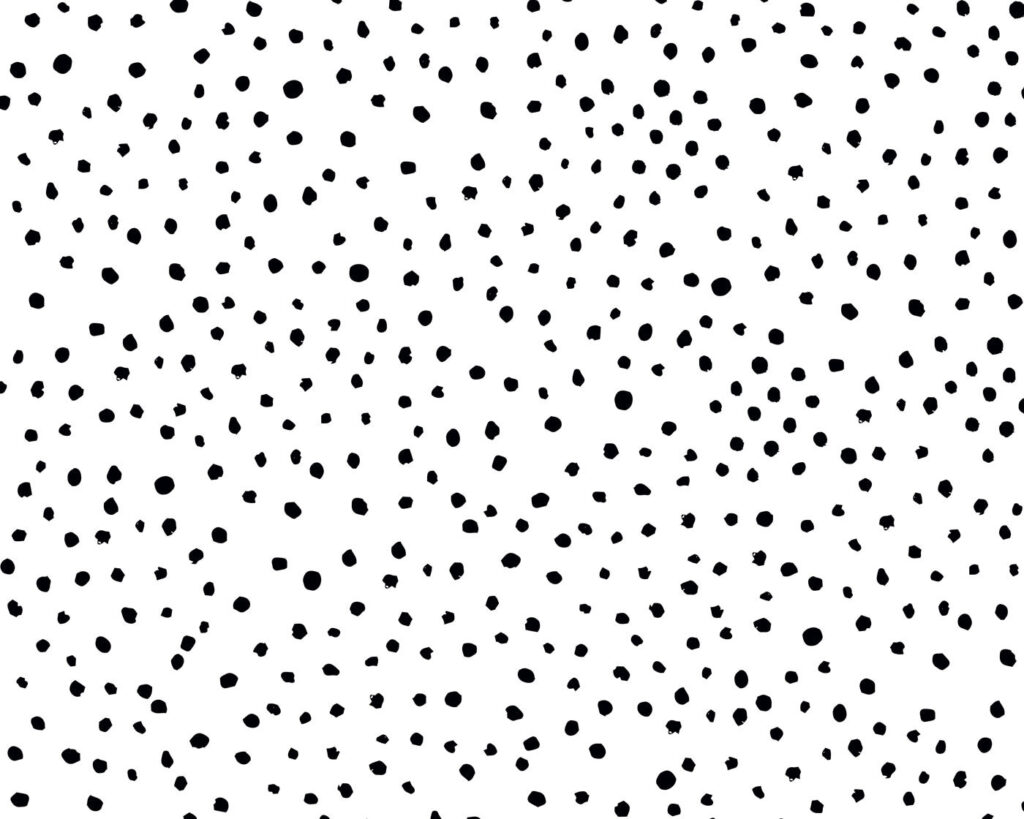 A black and white background with small black dots