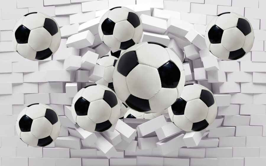 Skupina futbalových lôpt letiacich cez stenu Skupina futbalových lôpt letiacich cez stenu
