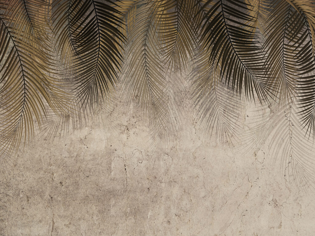 Palm leaves against a textured backdrop