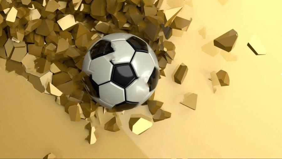 Futbalová lopta v hromade rozbitých kúskov