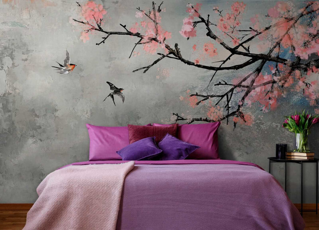 Tree branch with pink flowers and birds flying