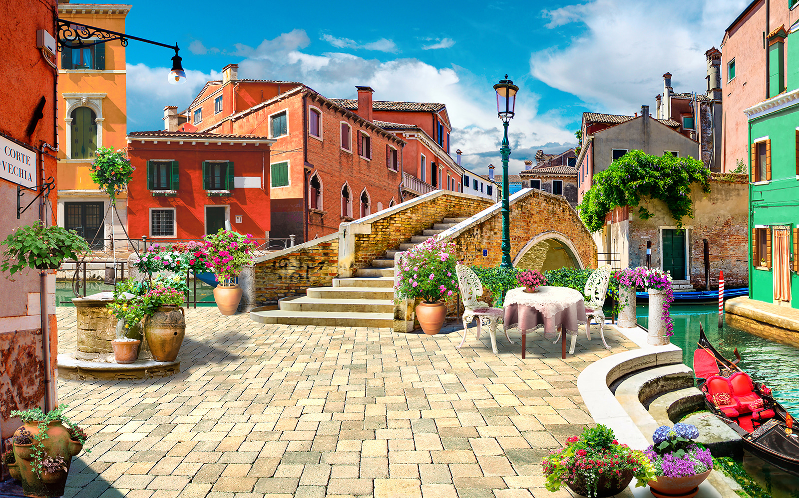 u18551p - Terasa so stolom a stoličkami a fontánou pred budovou - tegory