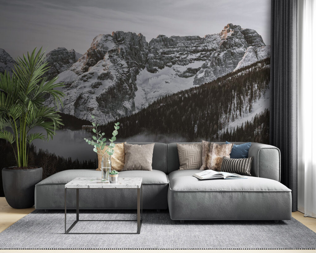 Snowy mountain range with trees and a building Snowy mountain range with trees and a building