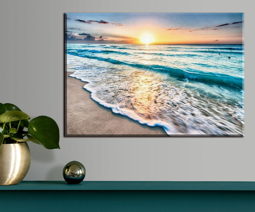 A beach with waves and a sunset