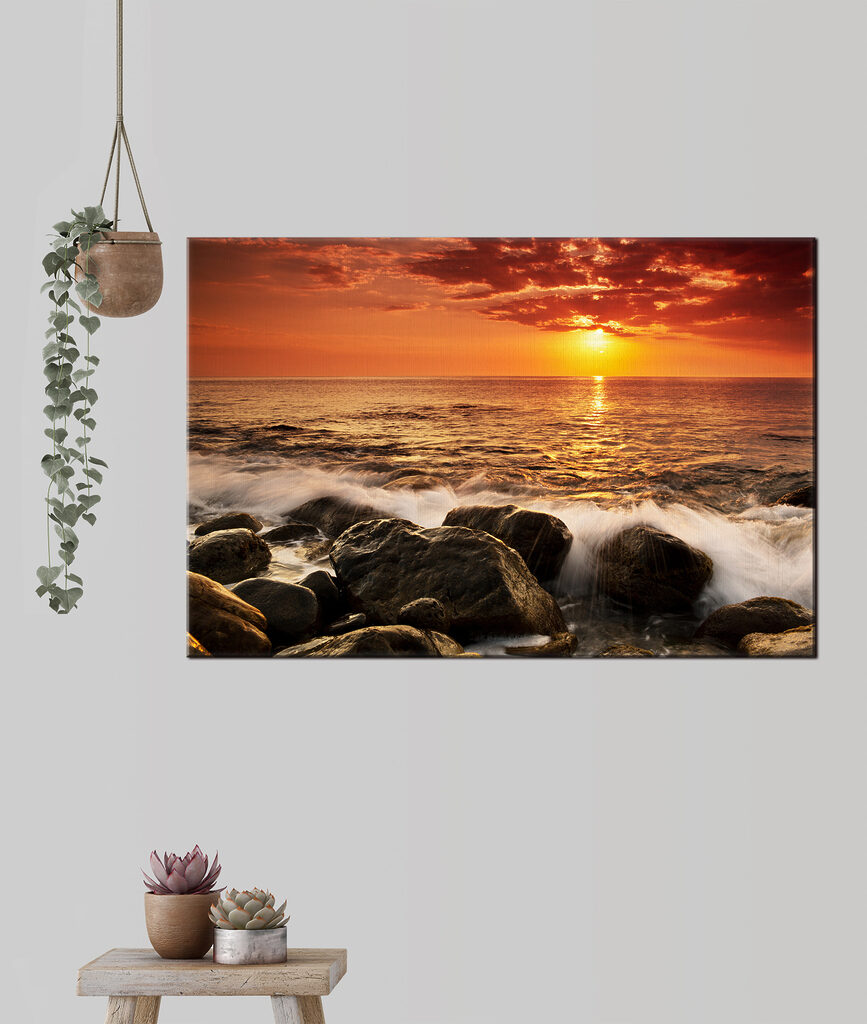 A sunset over a rocky beach