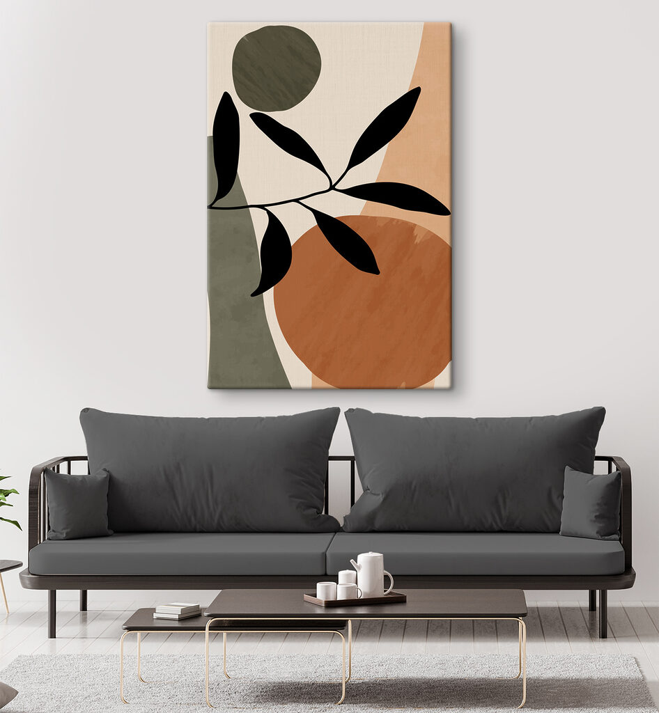 A black leaf on a branch with circles and circles