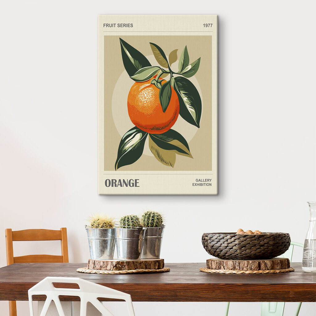 An orange with leaves on a branch