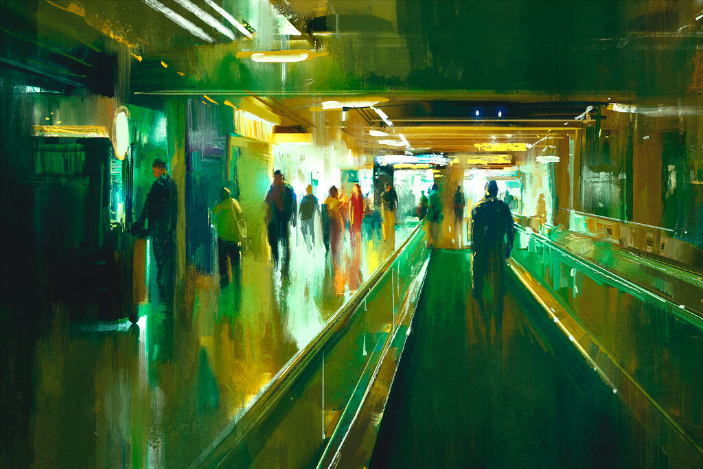 A group of people walking on an escalator A group of people walking on an escalator