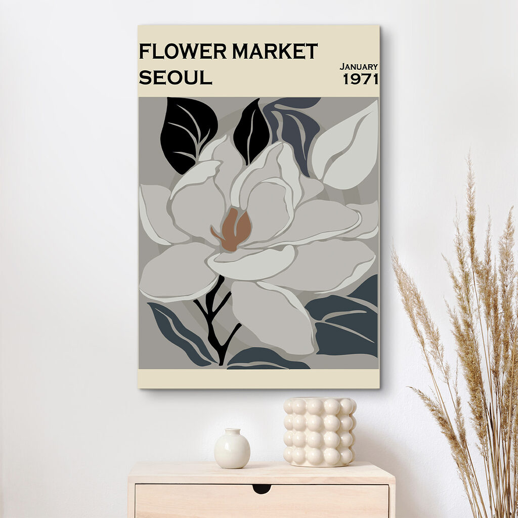 A white flower with black leaves A white flower with black leaves