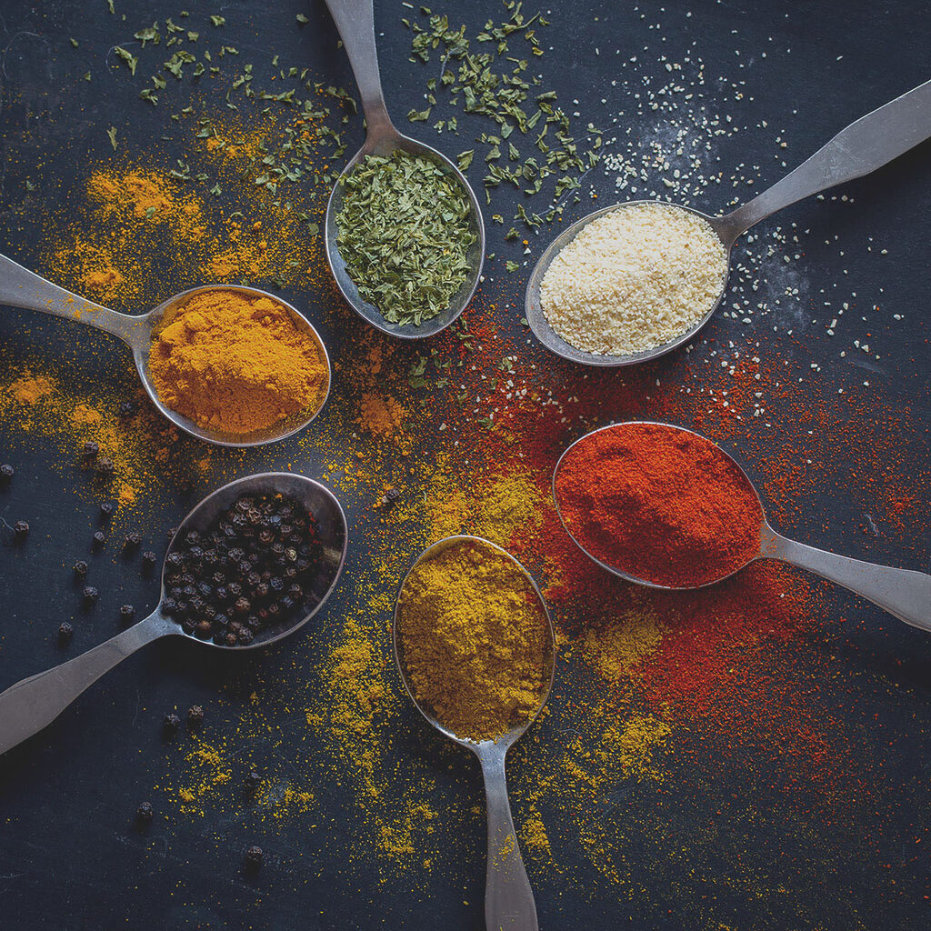 A group of spoons with different spices A group of spoons with different spices