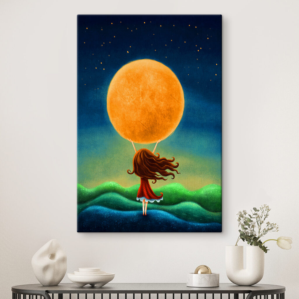 A girl holding a large yellow moon