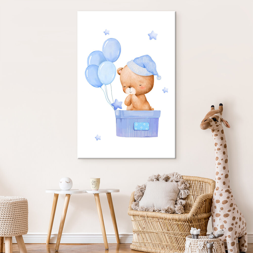 A teddy bear in a box with balloons A teddy bear in a box with balloons
