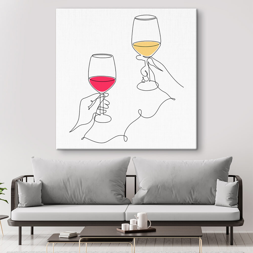 A hand holding wine glasses