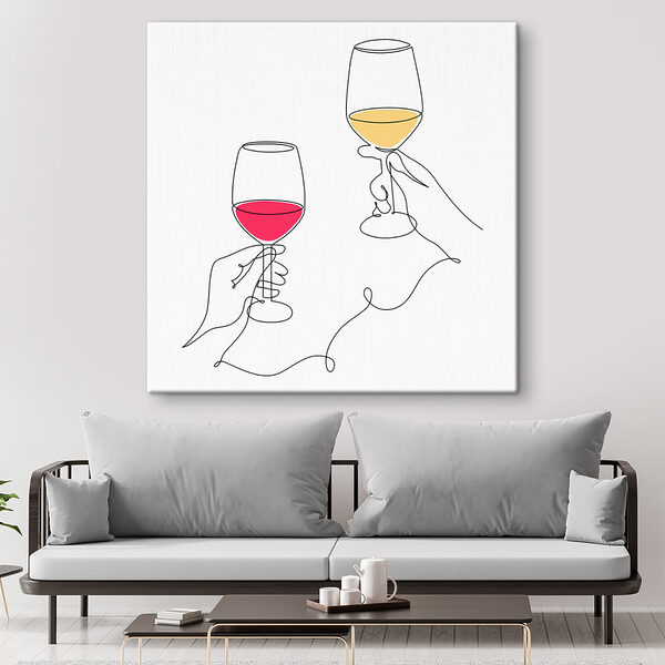 A hand holding wine glasses
