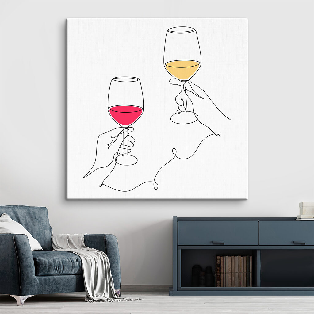 A hand holding wine glasses