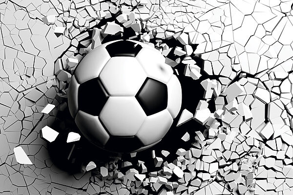 Futbalová lopta prerážajúca stenu Futbalová lopta prerážajúca stenu