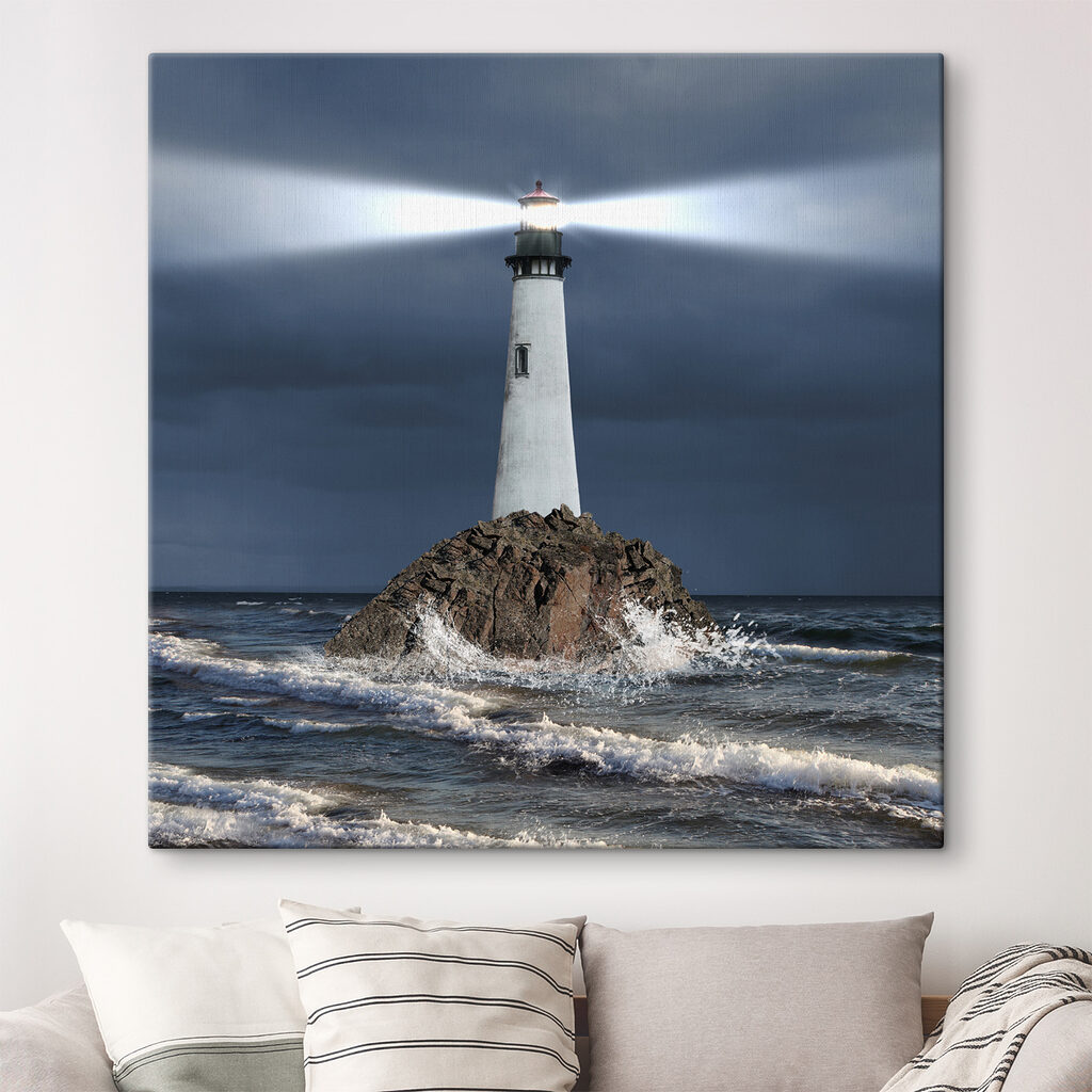 A lighthouse on a rock in the ocean
