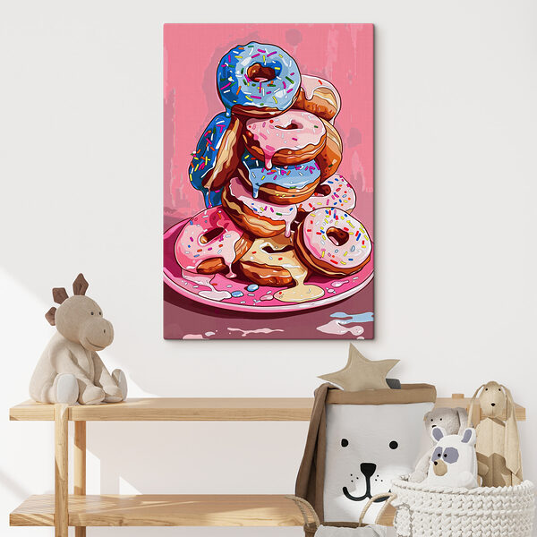 A stack of donuts with frosting and sprinkles A stack of donuts with frosting and sprinkles