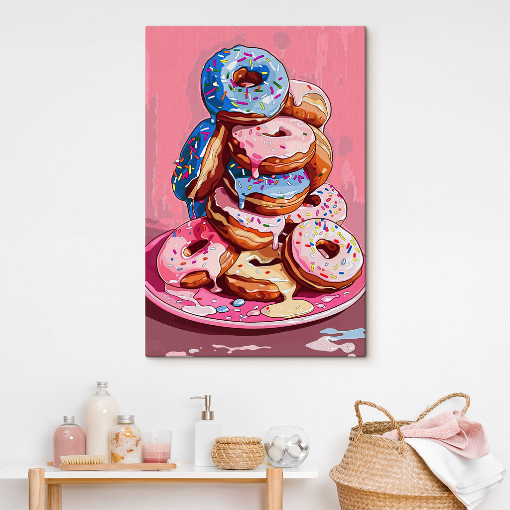 A stack of donuts with frosting and sprinkles A stack of donuts with frosting and sprinkles