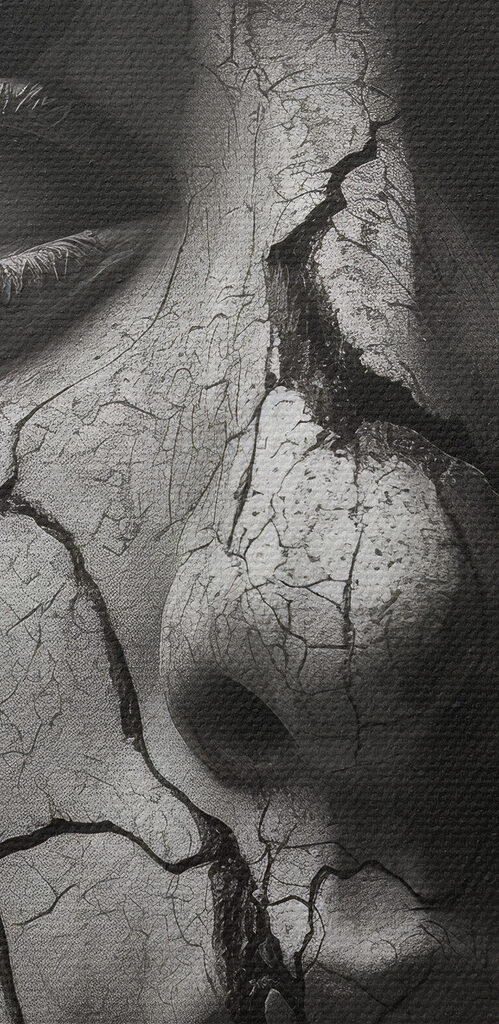 A statue of a woman with a cracked face and snakes around her face A statue of a woman with a cracked face and snakes around her face