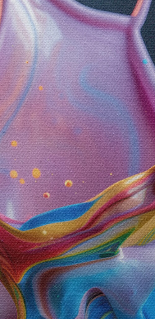 A colorful liquid splashing into a cup A colorful liquid splashing into a cup