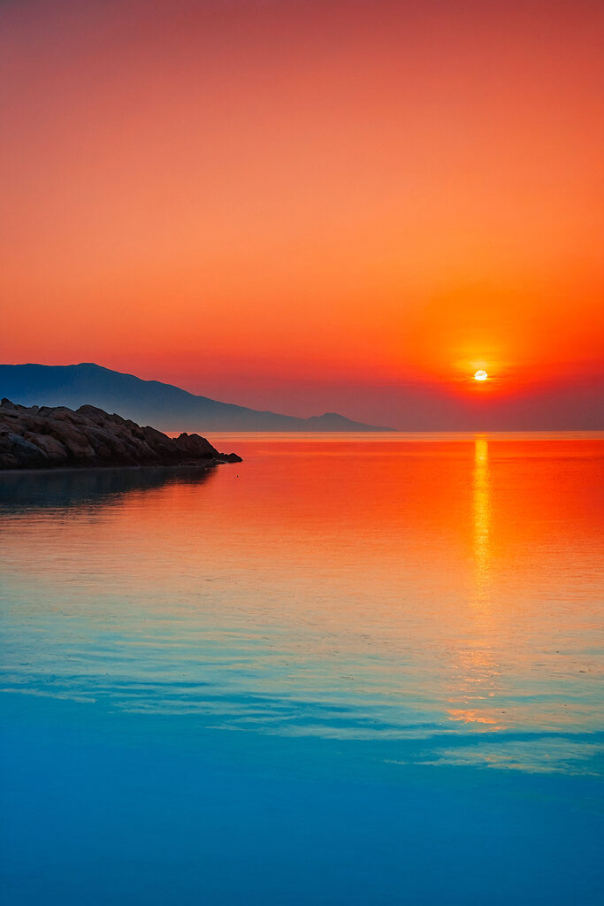 Sunset over a body of water Sunset over a body of water