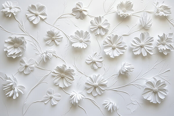 White paper flowers on a white surface