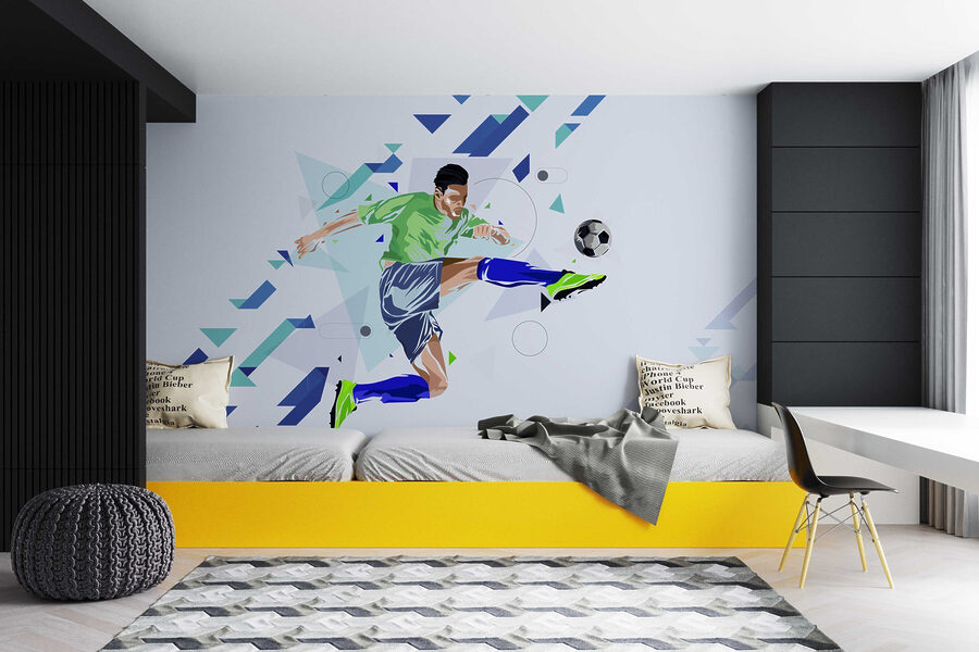 Muž kopajúci do futbalovej lopty