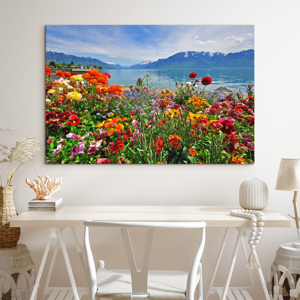 Flower bed with flowers and a lake in the background Flower bed with flowers and a lake in the background