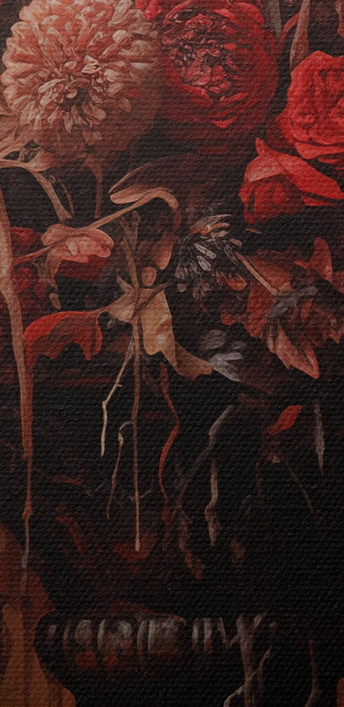 Black bird sitting on a vase of flowers and candles Black bird sitting on a vase of flowers and candles