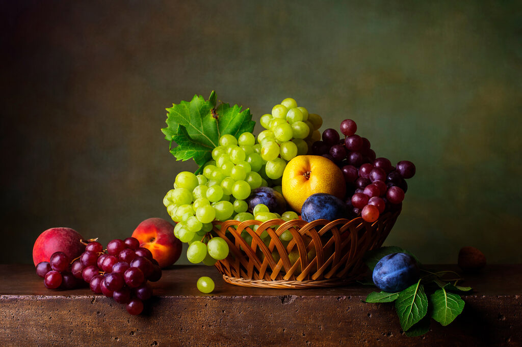 Basket of fruit on a table Basket of fruit on a table
