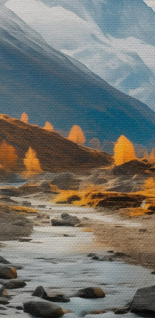 River running through a valley with mountains in the background