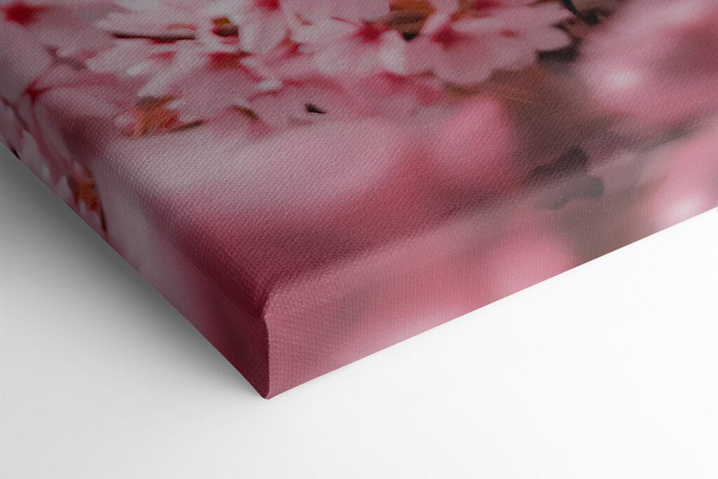 An owl in a tree with pink flowers