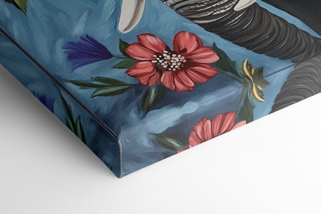 An elephant with tusks in a flower garden