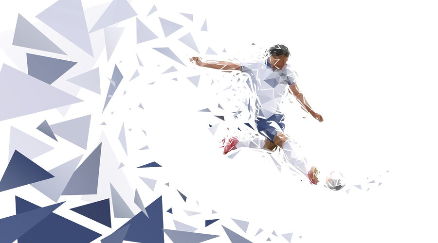 Muž kopajúci do futbalovej lopty Muž kopajúci do futbalovej lopty