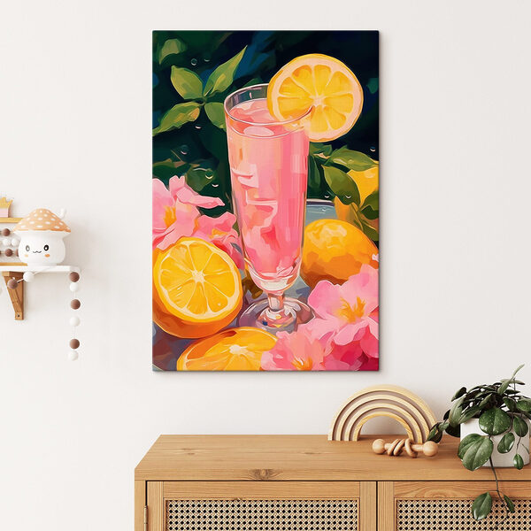 Glass of pink liquid with lemons and flowers Glass of pink liquid with lemons and flowers