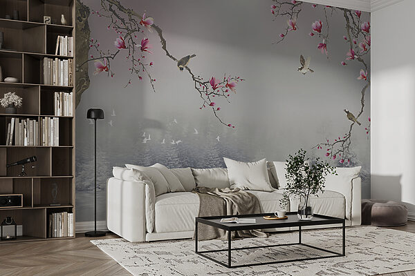 Tree branches with pink flowers and birds flying over water