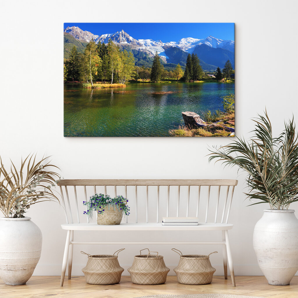 A lake surrounded by trees and mountains A lake surrounded by trees and mountains