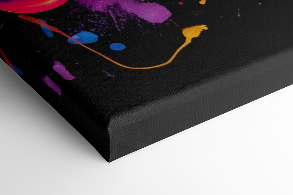 A video game controller with colorful paint splatters