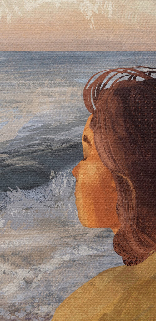 A woman sitting on a beach looking out to the ocean A woman sitting on a beach looking out to the ocean