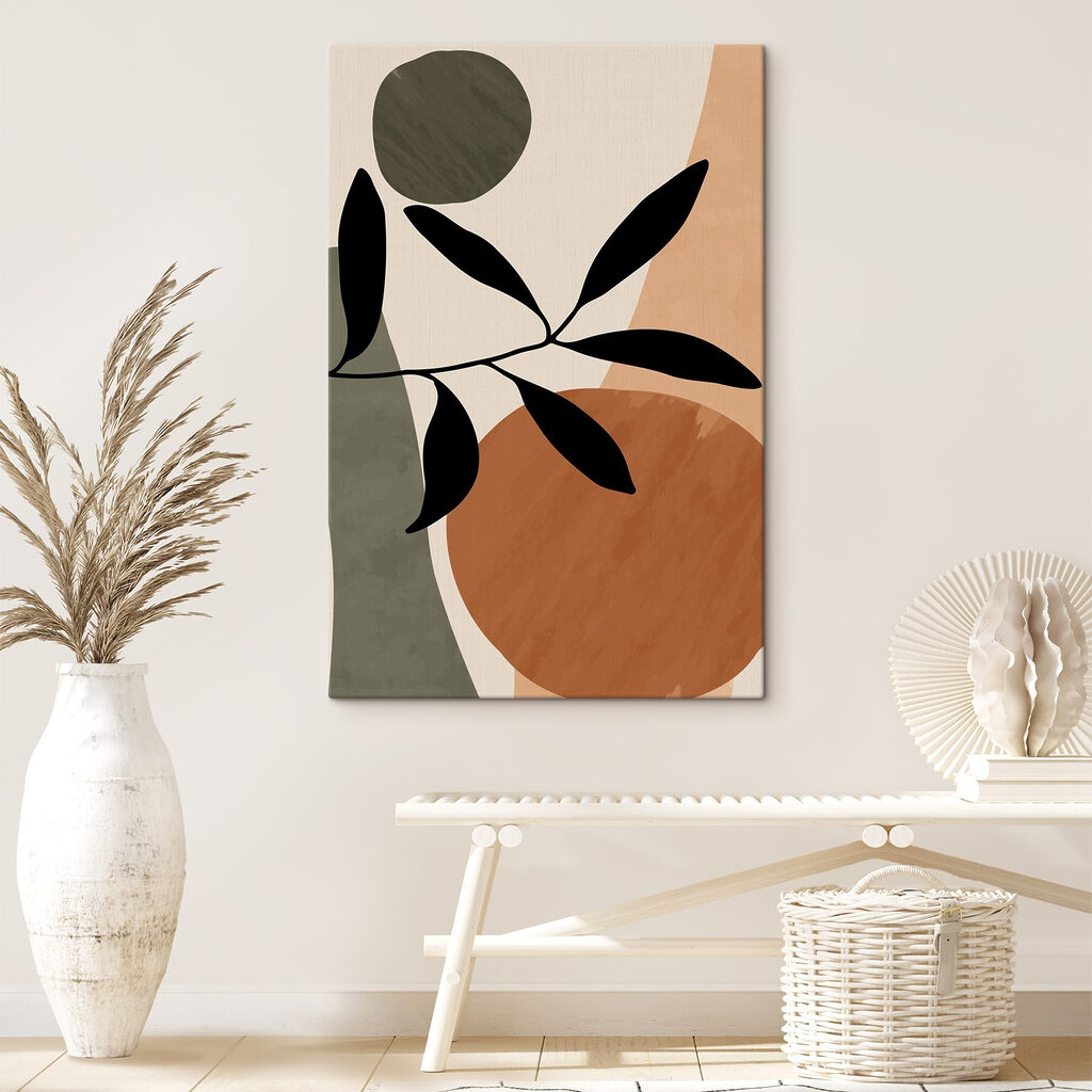 A black leaf on a branch with circles and circles