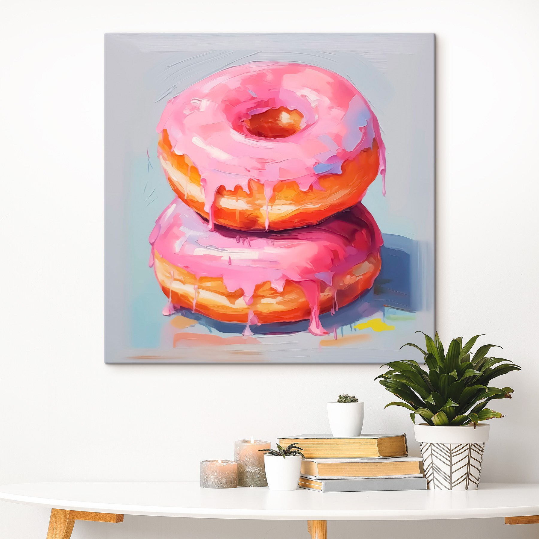 Two donuts with pink frosting