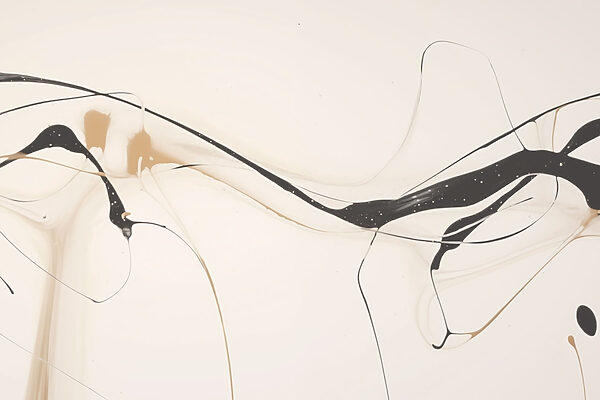 Black and tan paint on a white surface