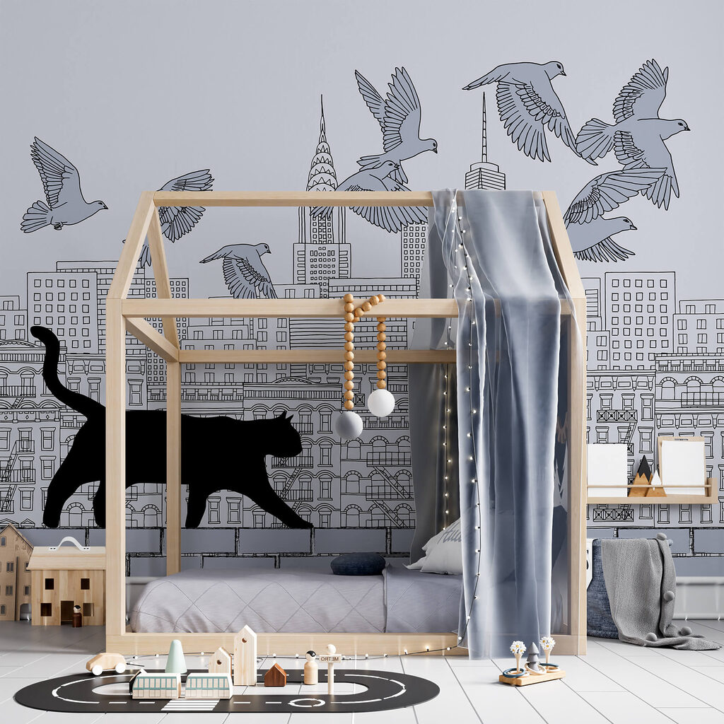 Mačka kráčajúca po stene s lietajúcimi vtákmi na oblohe Mačka kráčajúca po stene s lietajúcimi vtákmi na oblohe