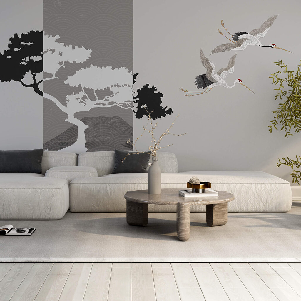 Pár žeriavov letiacich vedľa stromu