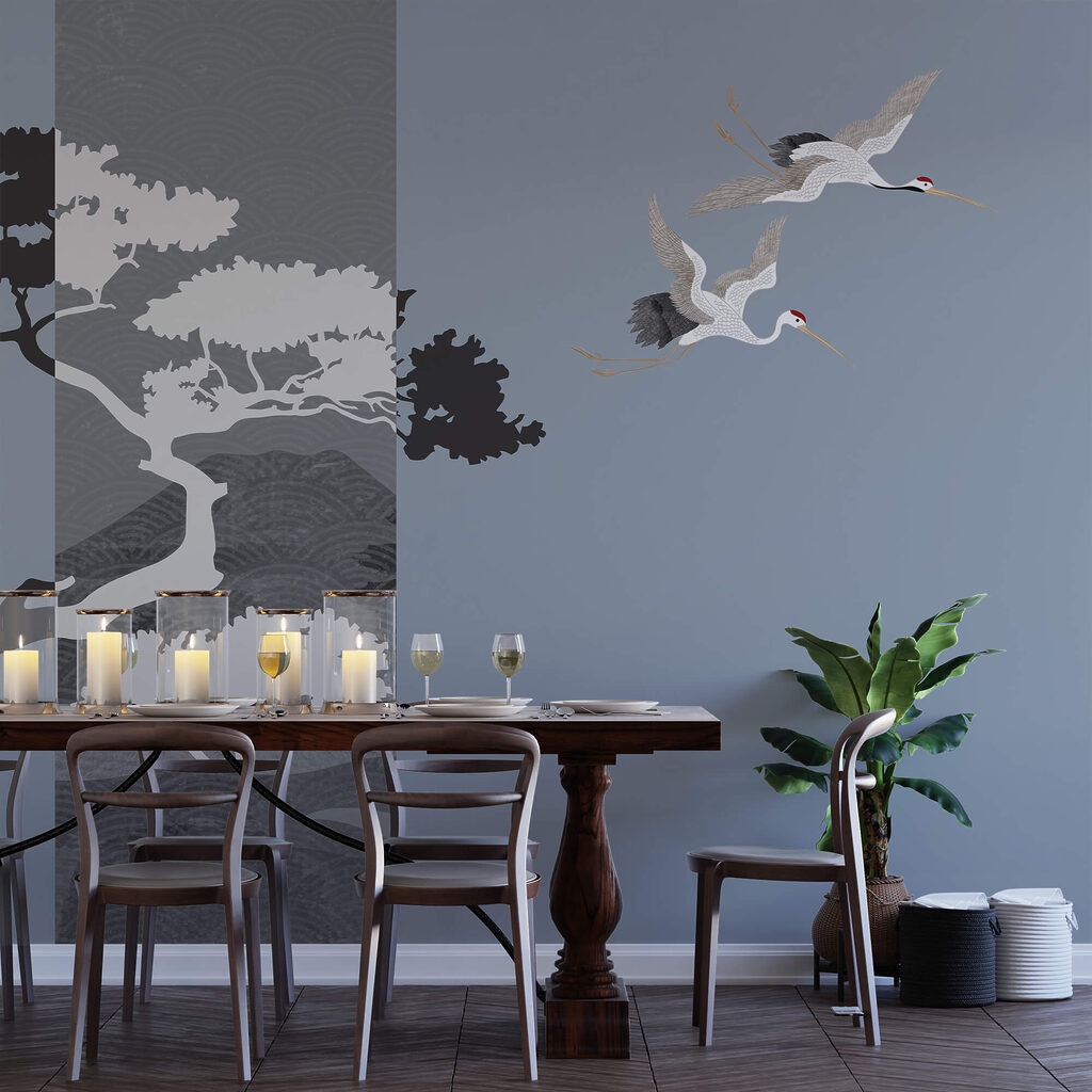 Pár žeriavov letiacich vedľa stromu