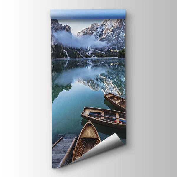 Boats on a lake with mountains in the background Boats on a lake with mountains in the background