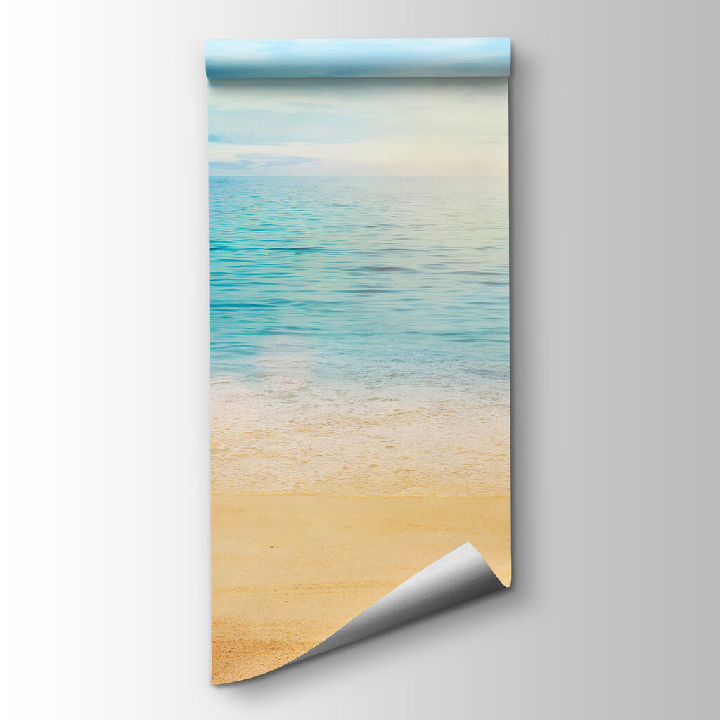 Sandy beach with blue water and a blue sky Sandy beach with blue water and a blue sky