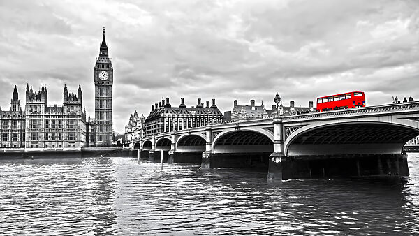 Bridge over water with a clock tower and a red bus Bridge over water with a clock tower and a red bus