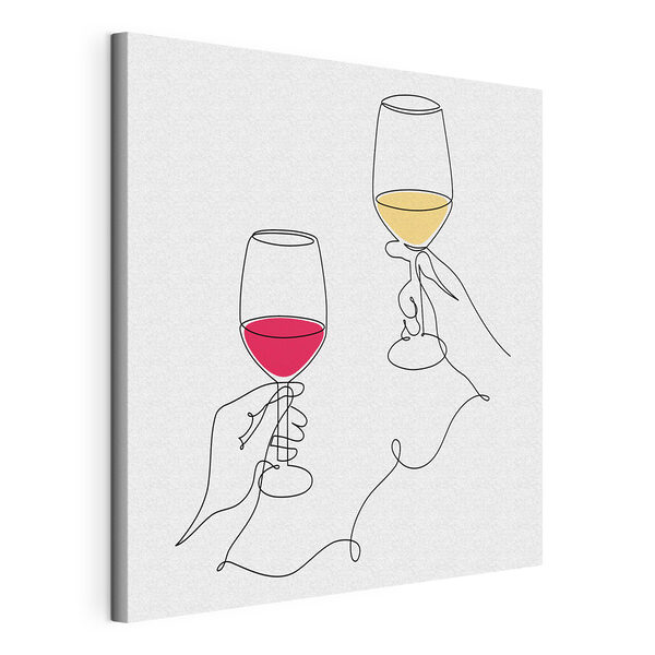 A hand holding wine glasses
